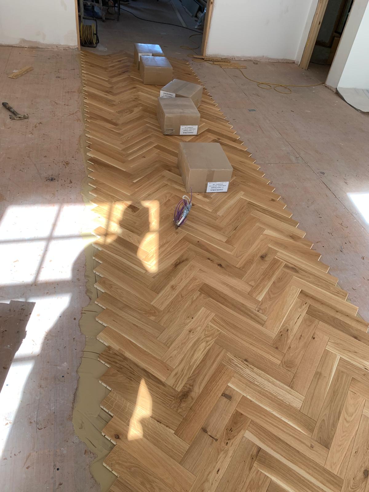 Herringbone floor being laid